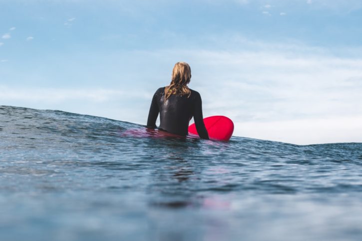 Surfer in water on surfboard
